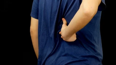 Man Massages Pain In The Back Vídeo Stock 100666404