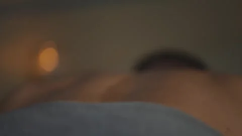 A man is massaging another man's back Stock Footage 302481173
