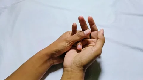 Man massaging his finger Stock Footage 285570657