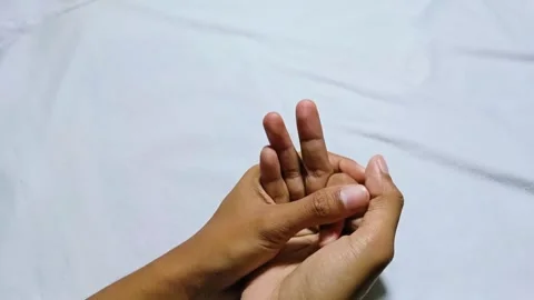 Man massaging his finger Stock Footage 285570680