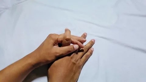 Man massaging his finger Stock Footage 285570686