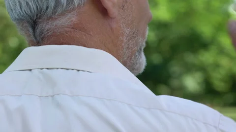 Man massaging numb neck, problems with spine, bad sleep conditions, healthcare Stock Footage 94392048