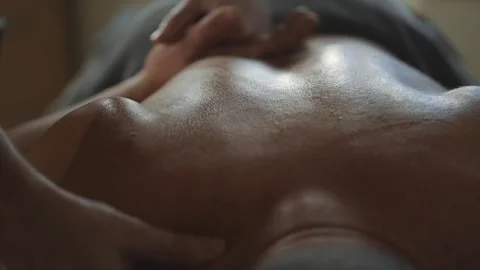 A man is massaging someone's back Stock Footage 302481115