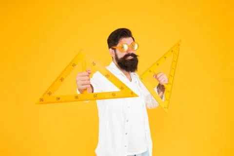 Man math lesson. Bearded nerd triangle. Geometry teacher. Student using Foto stock