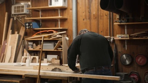 Man measures board to cut with table saw Stock Footage 102045024