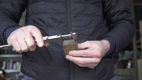 Man measures with a caliper Stock Footage 124969277