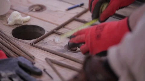 A man measures the length of the metal 스톡 동영상 86822968