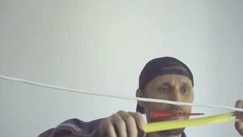 A man measures the length of the wire with a tape measure Stock Footage 155361336