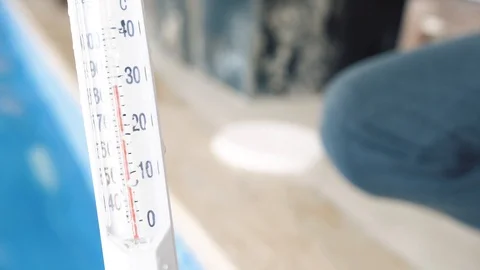 Man measures the temperature in the pool Stock Footage 127646277