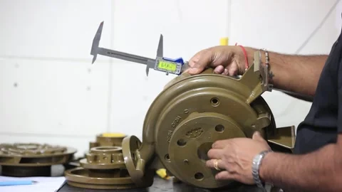 Man measuring of casting part in factory, industrial safety first concept Stock Footage 297739398