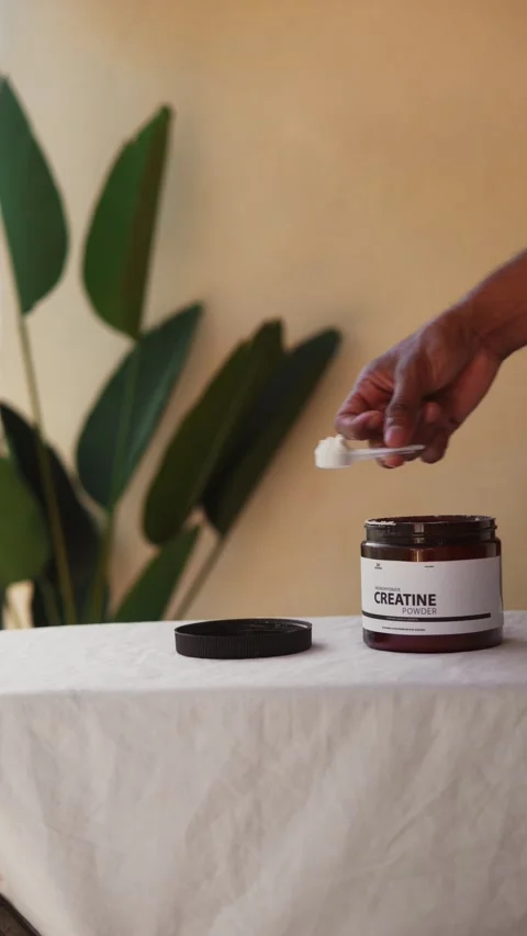 Man measuring creatine formula for performance Stock Footage 330190364