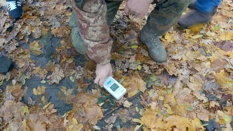 A man measuring level of radiation in Chernobyl Stock Footage 83232174