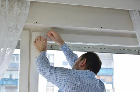 Man measuring a position of a hole Stock Photos