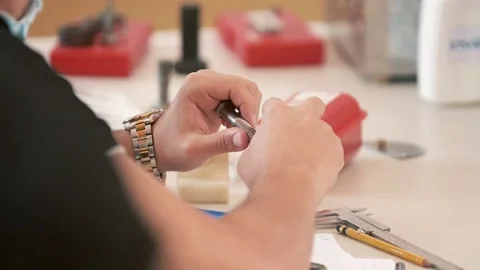 Man measuring a screw Stock Footage 159183078