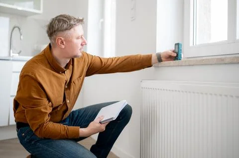 Man Measuring Window Height Stock Photos