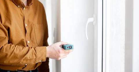Man Measuring Window Opening Stock Photos