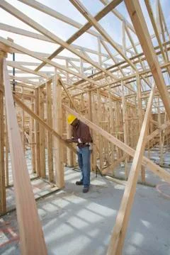 Man Measuring Wooden Beam In Framework Stock Photos