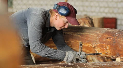 Man measuring a wooden post on the level Stock Footage 65315330