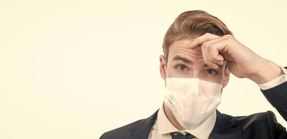 Man in medical protection mask isolated on white, copy space, safety business Stock Photos