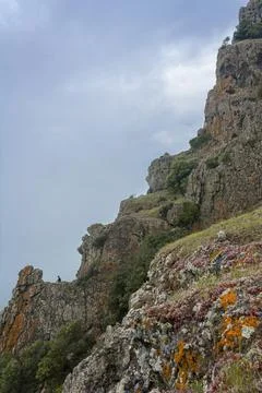 A man meditates on a mountain Stock Photos