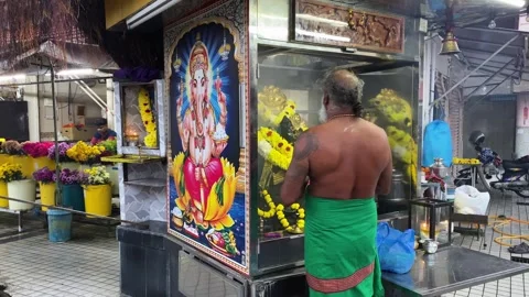 Man meditates in a small temple of Ganesh in Georgetown, Penang, Malaysia 4K Stock Footage 260108858