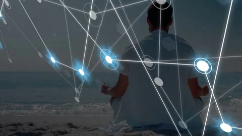 Man meditating on beach, animated nodes entering from left overlaying body, Stock Footage 334743906