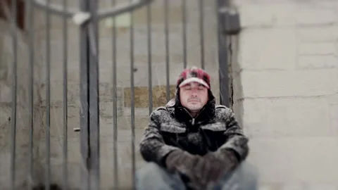Man Meditating During a Blizzard Stock Footage 162256951