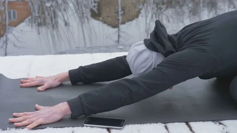 A man is meditating in nature in the winter. Yoga. Stock Footage 84871453