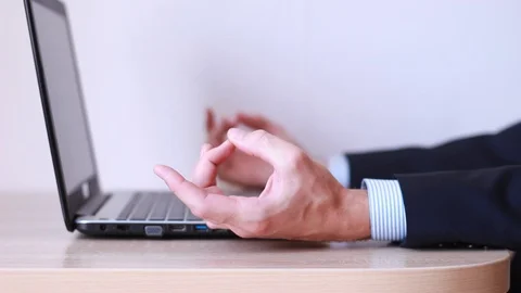 Man meditating in office sitting at the table Stock Footage 92410354