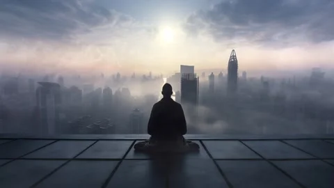 Man Meditating On A Rooftop Of A Big Skyscraper In A Huge City During A Fogg Stock Footage 266896944