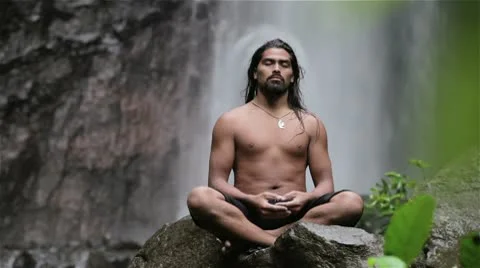 Man meditating at waterfall Stock Footage 10792296