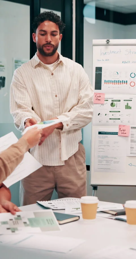 Man, meeting and documents with thinking in office, data analysis or ideas for Stock Footage 335921019