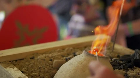 Man melts hard candy on a stick Stock Footage 82403211
