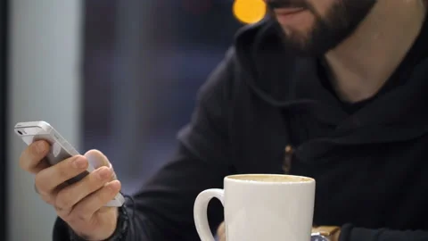 Man is messaging using smartphone Stock Footage 86385297