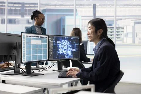 Man in microchip factory RD office training AI model Stock Photos