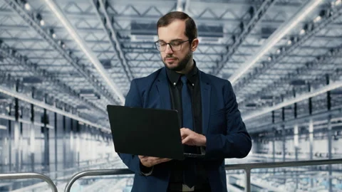 Man in microchip production plant thinking how to innovate engineering process Stock Footage 333384186