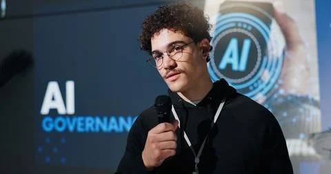 Man, microphone and programmer with speech at conference for AI governance Stock-Fotos