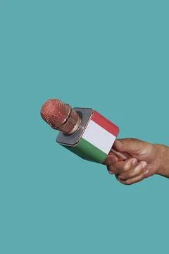 Man with a microphone patterned with the flag of italy Stock Photos