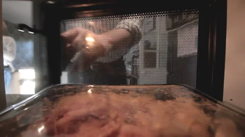 Man Microwave Meal in kitchen Stock Footage