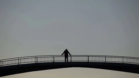 Man in the middle of the bridge Stock Footage 69862393