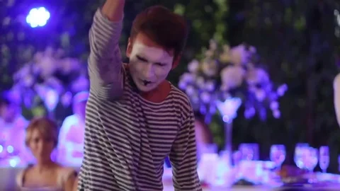 Man Mime shows a scene.Speech.Concert.Entertainment program Stock Footage 77463796
