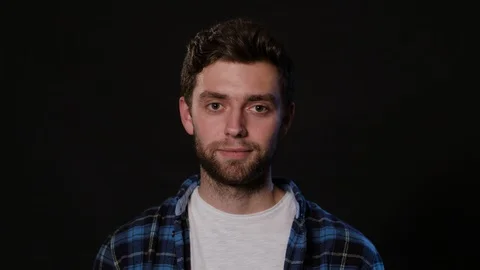 A Man Mimicing Against a Black Background Stock Footage 88443287