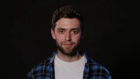 A Man Mimicing Against a Black Background Stock Footage 88443746