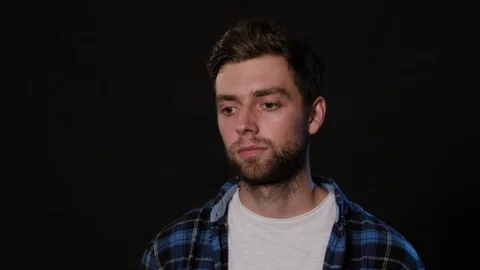 A Man Mimicing Against a Black Background Stock Footage 88458689