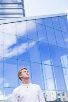 Man on a mirror building background Stock Photos