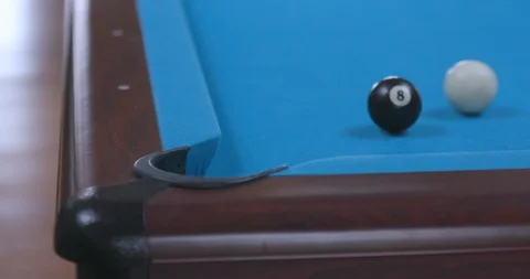 Man Missing Final 8 Ball Shot in Corner Pocket on Blue Billiards Table 動画素材 88227260