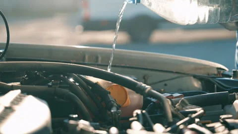 Man Missing Windshield Washer Fluid Reservoir While Pouring Water Stock Footage 339738871