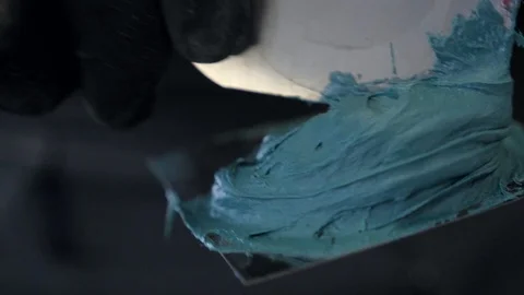 Man mix car putty close up slow motion. Stock Footage 86437380