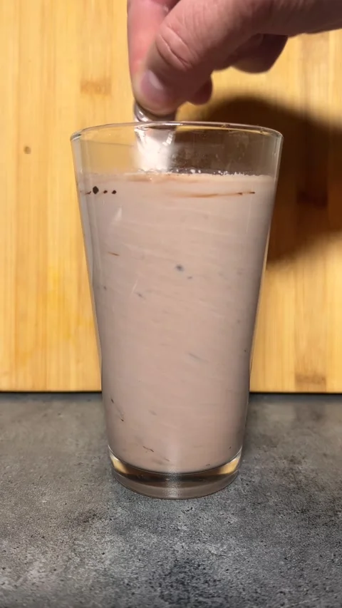 Man mixes cocoa with teaspoon Stock Footage 295246186
