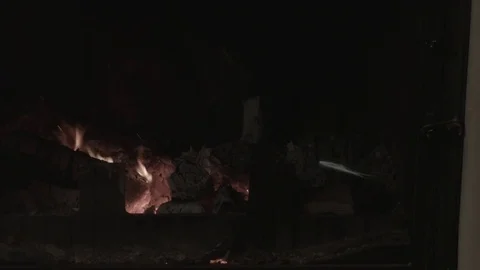 The man is mixing the coals 스톡 동영상 74196563